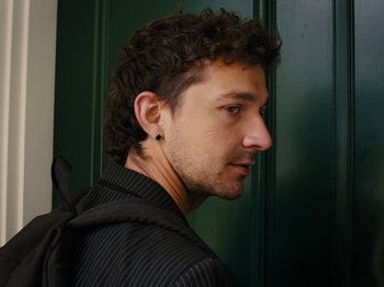 Movie still from “American Honey” (2016), directed by Andrea Arnold – A person wearing a black shirt; Close Up shot, Low angle