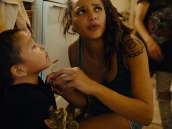 Movie still from “American Honey” (2016), directed by Andrea Arnold – A young woman is looking at a young boy; Close Up shot, High angle