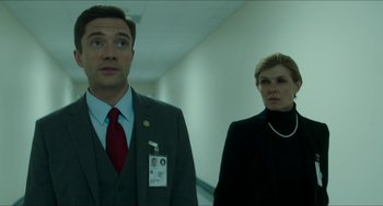 Movie still from “American Ultra” (2015), directed by Nima Nourizadeh – A man and a woman standing next to each other in a hallway; Medium shot, Low angle