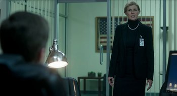 Movie still from “American Ultra” (2015), directed by Nima Nourizadeh – A woman standing in front of a man in front of a mirror; Medium shot, Over the shoulder angle