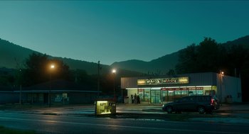 Movie still from “American Ultra” (2015), directed by Nima Nourizadeh – A night scene of a cash n ' carry store; Extreme Wide shot, High angle