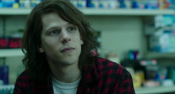 Movie still from “American Ultra” (2015), directed by Nima Nourizadeh – A man with long brown hair wearing a red and black checkered shirt; Close Up shot, Over the shoulder angle