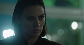 Movie still from “American Ultra” (2015), directed by Nima Nourizadeh – A woman's face in the dark; Close Up shot, Over the shoulder angle