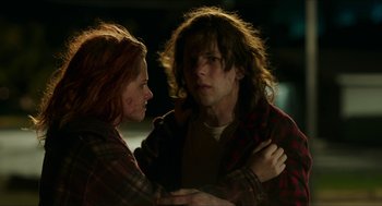 Movie still from “American Ultra” (2015), directed by Nima Nourizadeh – A man and a woman standing next to each other; Medium shot, Over the shoulder angle