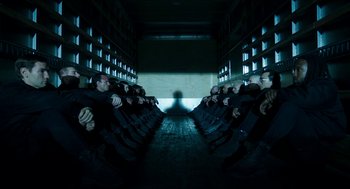 Movie still from “American Ultra” (2015), directed by Nima Nourizadeh – A group of people sitting in a room; Wide shot, Low angle