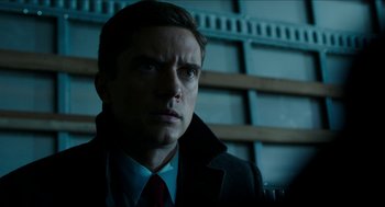 Movie still from “American Ultra” (2015), directed by Nima Nourizadeh – A person wearing a suit and tie; Close Up shot, Over the shoulder angle