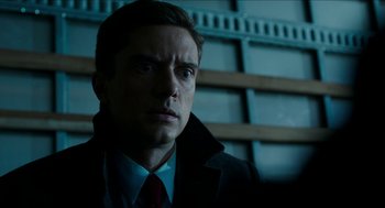 Movie still from “American Ultra” (2015), directed by Nima Nourizadeh – A person wearing a suit and tie; Close Up shot, Over the shoulder angle