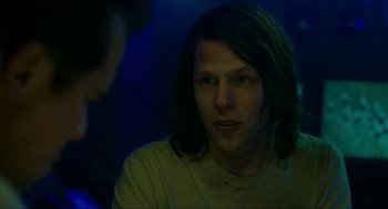 Movie still from “American Ultra” (2015), directed by Nima Nourizadeh – A man with long dark hair is looking at the camera; Close Up shot, Over the shoulder angle
