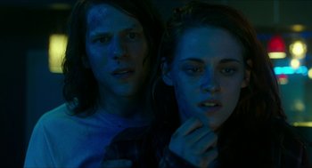 Movie still from “American Ultra” (2015), directed by Nima Nourizadeh – A man and a woman are looking at the camera; Close Up shot, Overhead angle