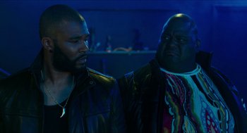 Movie still from “American Ultra” (2015), directed by Nima Nourizadeh – Two men are standing next to each other in the dark; Medium shot, Over the shoulder angle