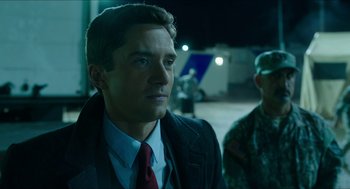 Movie still from “American Ultra” (2015), directed by Nima Nourizadeh – A person wearing a suit and tie; Close Up shot, Over the shoulder angle