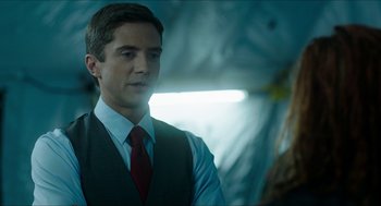 Movie still from “American Ultra” (2015), directed by Nima Nourizadeh – A man wearing a vest and a red neck tie; Close Up shot, Over the shoulder angle