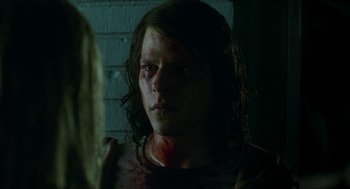 Movie still from “American Ultra” (2015), directed by Nima Nourizadeh – A woman with a bloody face looking into a mirror; Close Up shot, Over the shoulder angle