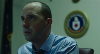 Movie still from “American Ultra” (2015), directed by Nima Nourizadeh – A man in a blue dress shirt and a tie; Close Up shot, Low angle