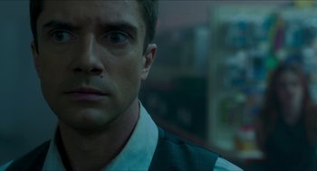 Movie still from “American Ultra” (2015), directed by Nima Nourizadeh – A man's face in front of a store window; Close Up shot, Over the shoulder angle