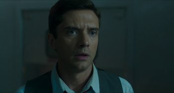 Movie still from “American Ultra” (2015), directed by Nima Nourizadeh – A person wearing a shirt and tie; Close Up shot, Over the shoulder angle