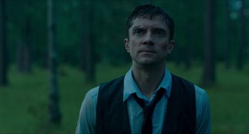 Movie still from “American Ultra” (2015), directed by Nima Nourizadeh – A person wearing a vest and a tie; Close Up shot, Low angle