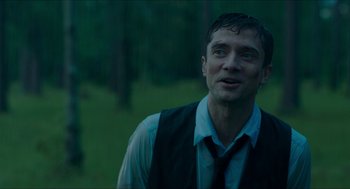 Movie still from “American Ultra” (2015), directed by Nima Nourizadeh – A person wearing a vest and a tie; Close Up shot, Over the shoulder angle