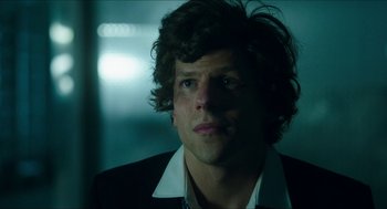 Movie still from “American Ultra” (2015), directed by Nima Nourizadeh – A person wearing a suit and tie; Close Up shot, Over the shoulder angle