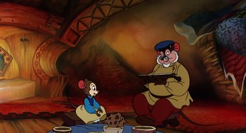 Movie still from “An American Tail” (1986), directed by Don Bluth – A couple of cartoon characters sitting on top of a floor; Medium shot, High angle