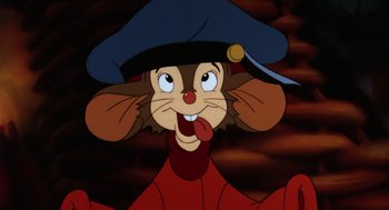 Movie still from “An American Tail” (1986), directed by Don Bluth – A cartoon character with his tongue hanging out; Close Up shot, High angle