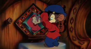 Movie still from “An American Tail” (1986), directed by Don Bluth – A picture of a mouse and a violin in front of a mirror; Medium shot, Over the shoulder angle