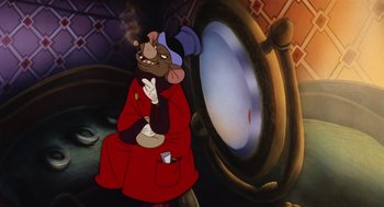 Movie still from “An American Tail” (1986), directed by Don Bluth – A picture of a cartoon character sitting in front of a mirror; Medium shot, High angle