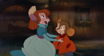 Movie still from “An American Tail” (1986), directed by Don Bluth – A woman and a boy are holding each other; Medium shot, High angle