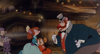 Movie still from “An American Tail” (1986), directed by Don Bluth – A couple of people that are sitting in front of an old man; Medium shot, Over the shoulder angle