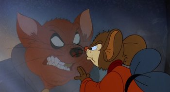 Movie still from “An American Tail” (1986), directed by Don Bluth – A cartoon picture of a mouse looking at a cat; Close Up shot, Over the shoulder angle