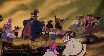 Movie still from “An American Tail” (1986), directed by Don Bluth – A group of people standing next to each other on top of a hill; Wide shot, Low angle