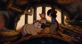 Movie still from “An American Tail” (1986), directed by Don Bluth – A group of cartoon characters are in a cave; Wide shot, High angle