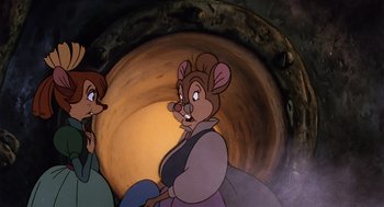 Movie still from “An American Tail” (1986), directed by Don Bluth – A couple of people standing next to each other in front of a tunnel; Medium shot, High angle