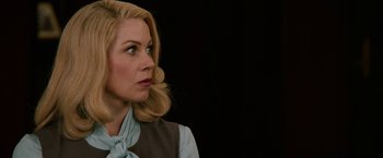 Movie still from “Anchorman 2: The Legend Continues” (2013), directed by Adam McKay – A woman with blonde hair wearing a blue shirt; Close Up shot, Over the shoulder angle