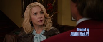 Movie still from “Anchorman 2: The Legend Continues” (2013), directed by Adam McKay – A woman sitting in front of a computer screen; Close Up shot, Over the shoulder angle