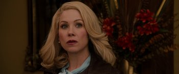Movie still from “Anchorman 2: The Legend Continues” (2013), directed by Adam McKay – A woman with blonde hair and blue eyes looking to her left; Close Up shot, Over the shoulder angle