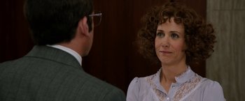 Movie still from “Anchorman 2: The Legend Continues” (2013), directed by Adam McKay – A man and a woman are standing next to each other; Close Up shot, Over the shoulder angle
