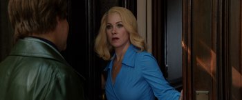 Movie still from “Anchorman 2: The Legend Continues” (2013), directed by Adam McKay – A woman with blonde hair wearing a blue shirt; Close Up shot, Over the shoulder angle