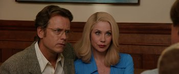 Movie still from “Anchorman 2: The Legend Continues” (2013), directed by Adam McKay – A man and a woman sitting next to each other; Close Up shot, Over the shoulder angle