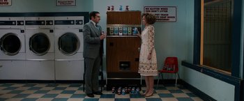 Movie still from “Anchorman 2: The Legend Continues” (2013), directed by Adam McKay – A man and a woman standing in front of a refrigerator; Wide shot, Low angle