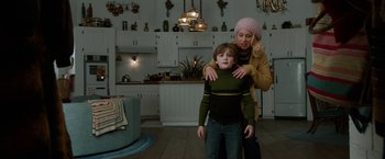 Movie still from “Anchorman 2: The Legend Continues” (2013), directed by Adam McKay – A woman and a child in a room; Medium shot, Low angle