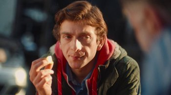 Movie still from “And Then We Danced” (2019), directed by Levan Akin – A young man holding an orange in his hand; Close Up shot, Low angle