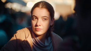 Movie still from “And Then We Danced” (2019), directed by Levan Akin – A person wearing a jacket; Close Up shot, Over the shoulder angle