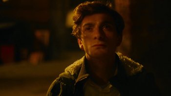 Movie still from “And Then We Danced” (2019), directed by Levan Akin – A man in a brown jacket is looking to his left; Close Up shot, Low angle