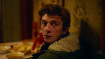 Movie still from “And Then We Danced” (2019), directed by Levan Akin – A young man is looking into the distance; Close Up shot, Over the shoulder angle