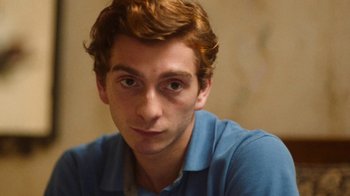 Movie still from “And Then We Danced” (2019), directed by Levan Akin – A person wearing a blue shirt; Close Up shot, Low angle