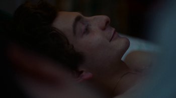 Movie still from “And Then We Danced” (2019), directed by Levan Akin – A man laying on top of a bed with his eyes closed; Close Up shot, Over the shoulder angle