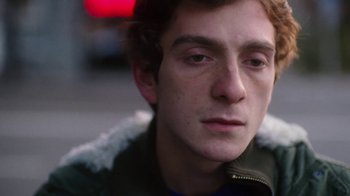 Movie still from “And Then We Danced” (2019), directed by Levan Akin – A person wearing a jacket; Close Up shot, Low angle