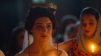 Movie still from “And Then We Danced” (2019), directed by Levan Akin – A woman with a crown on her head; Close Up shot, Over the shoulder angle