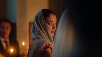 Movie still from “And Then We Danced” (2019), directed by Levan Akin – A young woman wearing a veil looking into a mirror; Close Up shot, Over the shoulder angle